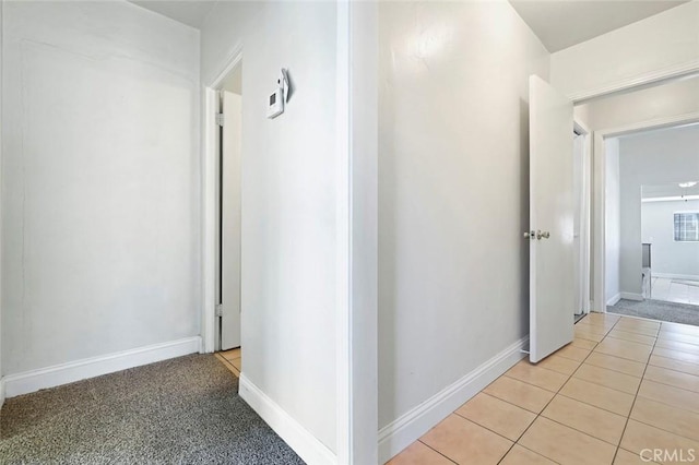 hallway featuring light tile patterned floors