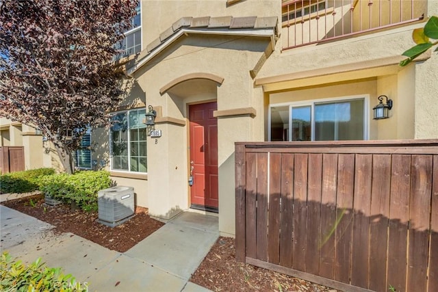 doorway to property with central AC unit