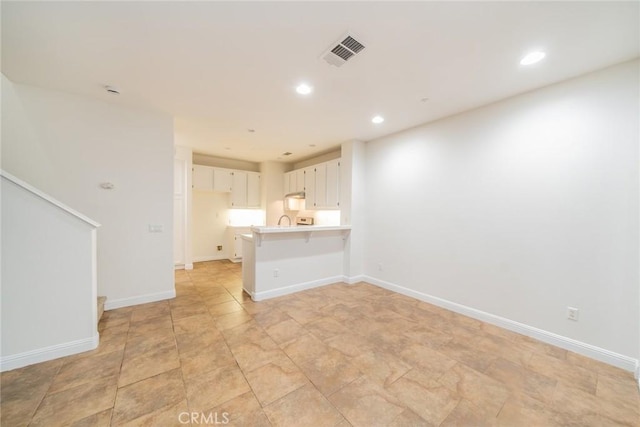 41985 Davenport Way Unit B, Murrieta, CA 92562 - unfurnished living room with baseboards, stairway, visible vents, and recessed lighting