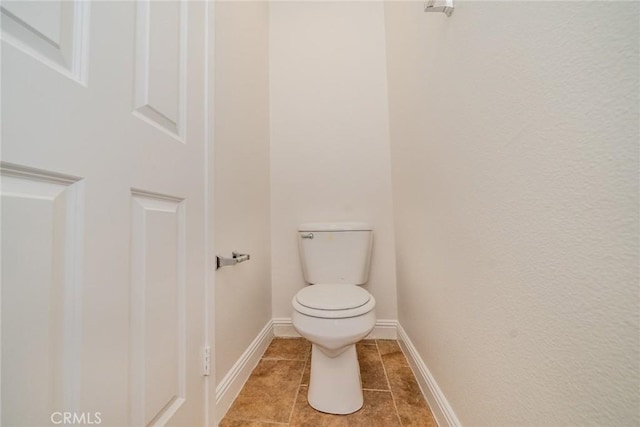 41985 Davenport Way Unit B, Murrieta, CA 92562 - bathroom with baseboards, toilet, and tile patterned floors