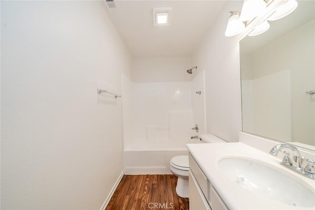 full bathroom featuring toilet, vanity, washtub / shower combination, and hardwood / wood-style floors