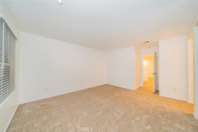 unfurnished bedroom with light carpet