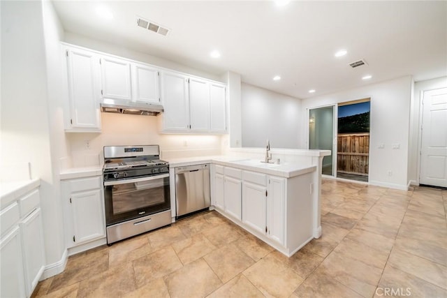 41985 Davenport Way Unit B, Murrieta, CA 92562 - kitchen with visible vents, a peninsula, appliances with stainless steel finishes, under cabinet range hood, and white cabinetry