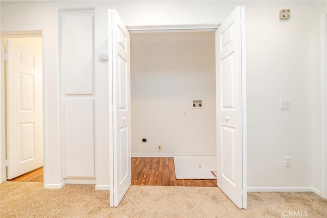 interior space featuring carpet floors and hookup for a washing machine