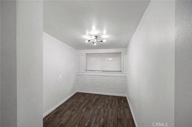 spare room featuring dark hardwood / wood-style floors