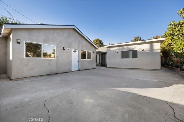 back of property featuring a patio area