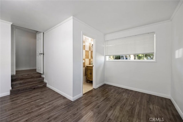 unfurnished room featuring dark hardwood / wood-style floors and crown molding