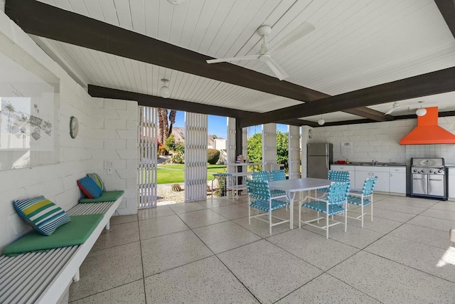 view of patio with grilling area, ceiling fan, and sink