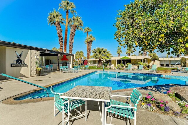 view of swimming pool featuring a patio