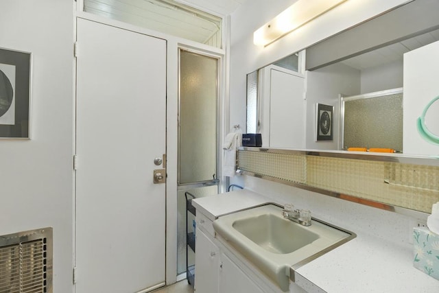 bathroom with vanity and walk in shower