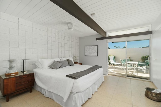 bedroom featuring ceiling fan, beamed ceiling, access to outside, light tile patterned flooring, and tile walls