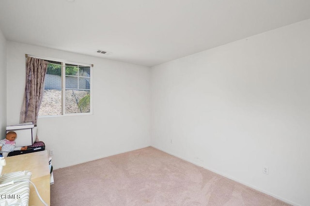 unfurnished room with carpet floors