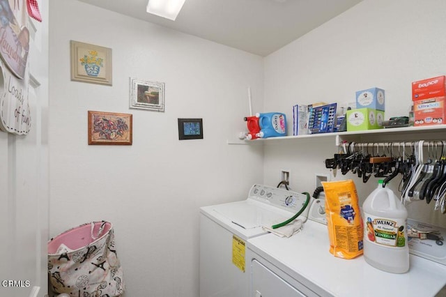 washroom featuring washer and dryer