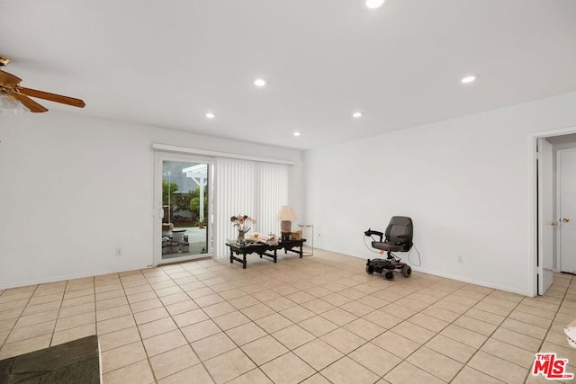 unfurnished room featuring ceiling fan and light tile patterned floors