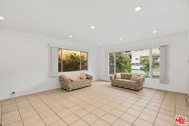 unfurnished room featuring light tile patterned floors