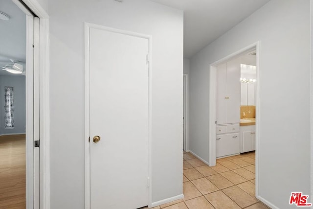 hallway with light tile patterned floors