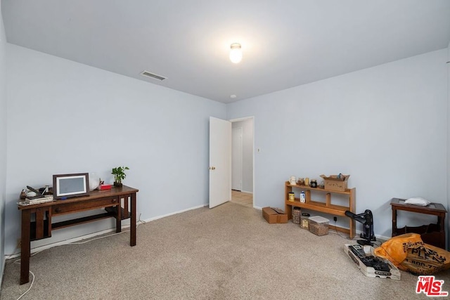 misc room featuring light colored carpet