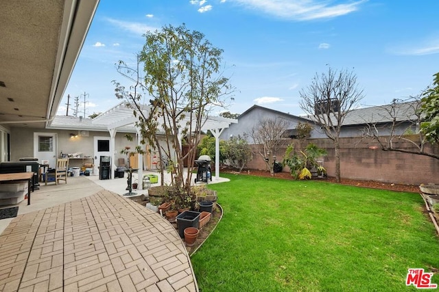 view of yard featuring a pergola and a patio