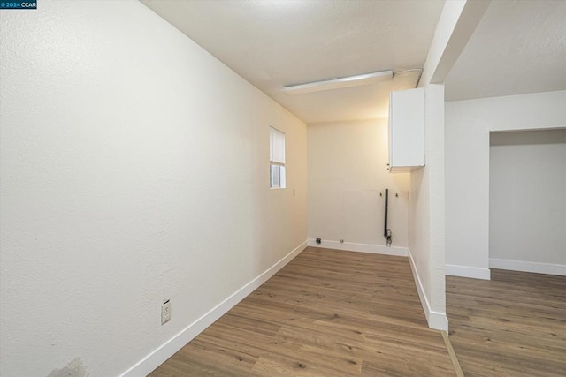 laundry area featuring hardwood / wood-style floors