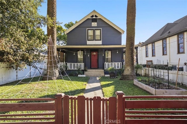 view of front of home featuring a porch and a front yard