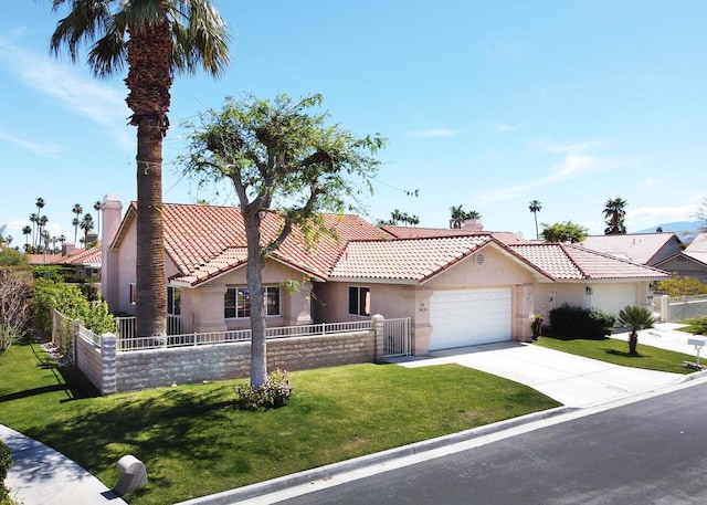 view of front of property featuring a front yard and a garage