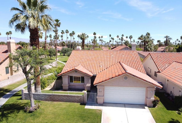 view of front of home featuring a front yard and a garage