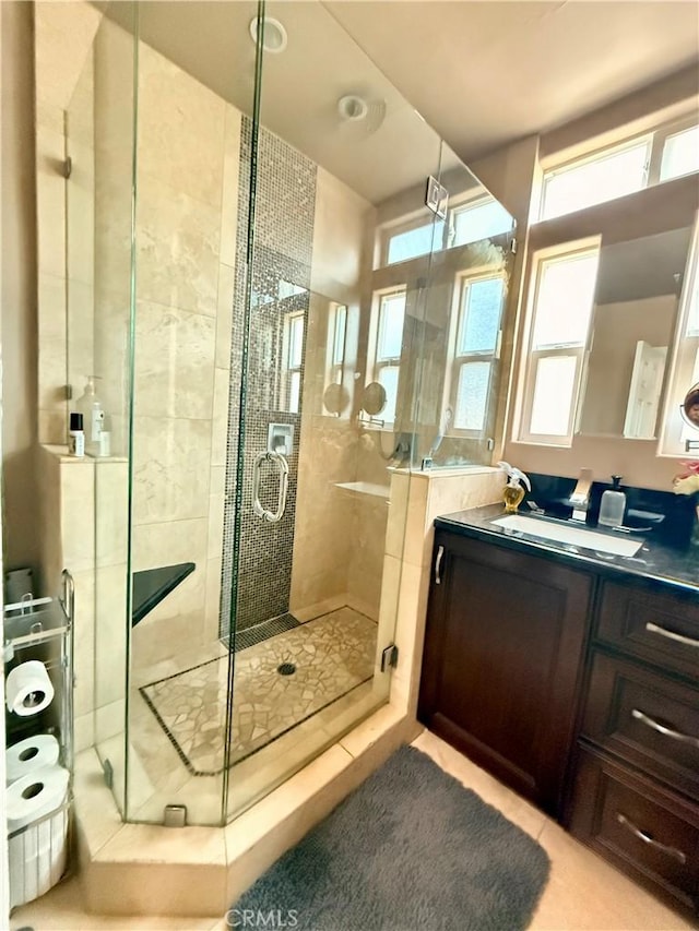 bathroom with vanity and an enclosed shower