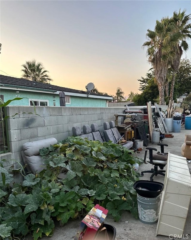 view of patio terrace at dusk