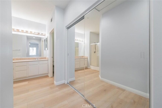 807 Yorkshire, Irvine, CA 92620 - hallway with light wood-type flooring and baseboards