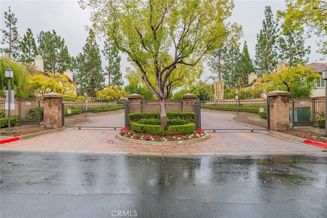 807 Yorkshire, Irvine, CA 92620 - view of decorative road with a gate, curbs, and a gated entry
