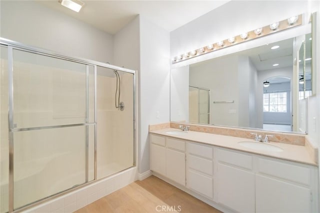 807 Yorkshire, Irvine, CA 92620 - bathroom with a shower stall, double vanity, and wood finished floors