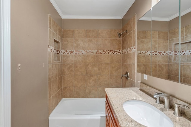 bathroom with vanity, tiled shower / bath, and crown molding