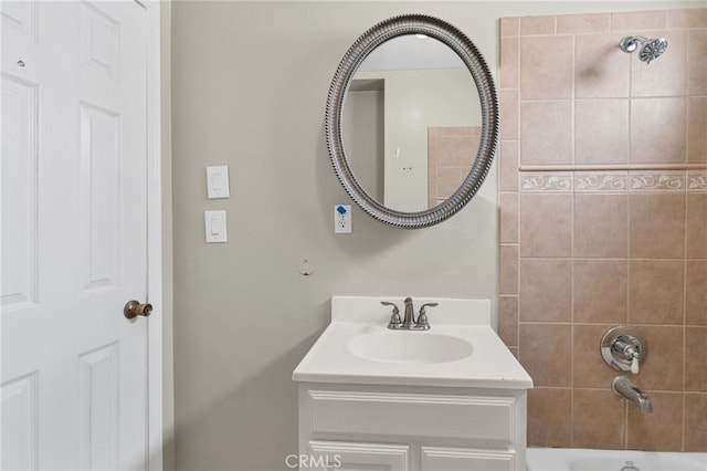 bathroom with vanity and tiled shower / bath combo