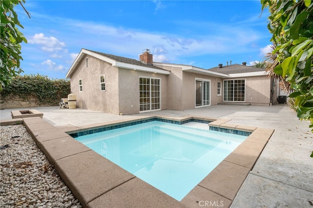 view of swimming pool featuring a patio