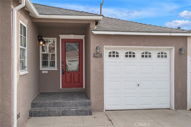 entrance to property featuring a garage