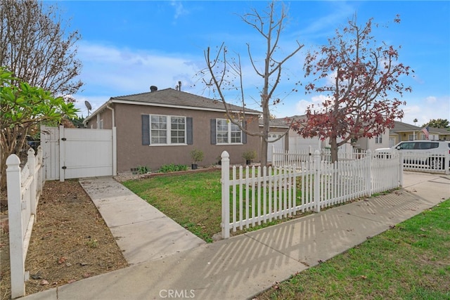 view of front of property with a front lawn