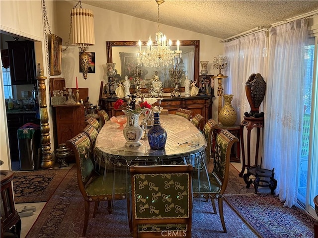 dining room with a textured ceiling, lofted ceiling, and a chandelier