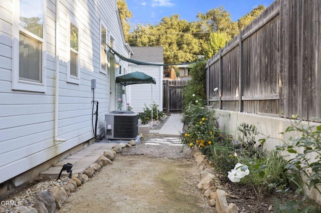 view of side of property with central AC unit