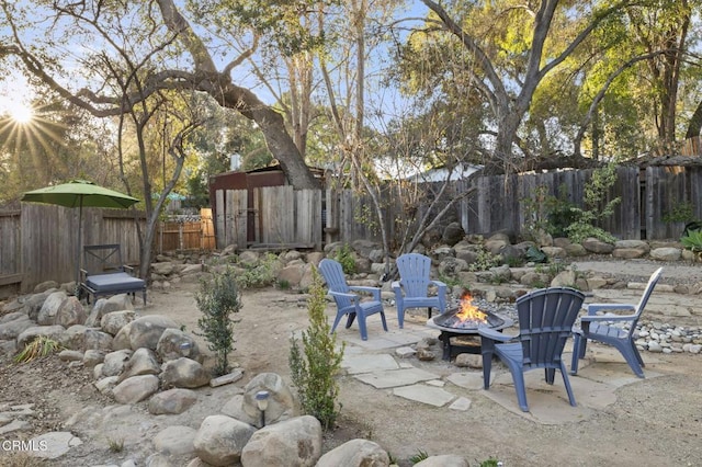 view of patio with a fire pit