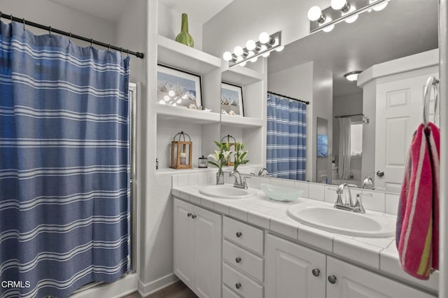 bathroom featuring a shower with curtain and vanity