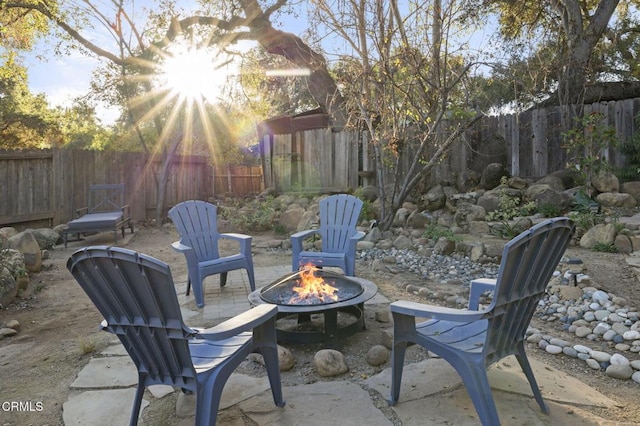 view of patio / terrace with an outdoor fire pit