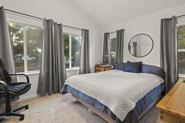 bedroom with carpet flooring and lofted ceiling