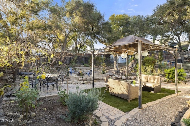 exterior space featuring a gazebo and outdoor lounge area