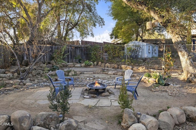 view of patio / terrace featuring a fire pit