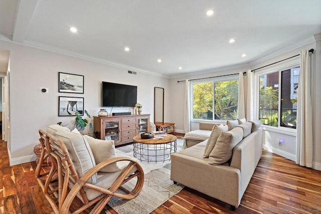 living room with dark wood-type flooring and ornamental molding