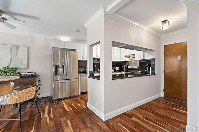 kitchen with white cabinetry, ceiling fan, appliances with stainless steel finishes, tasteful backsplash, and ornamental molding