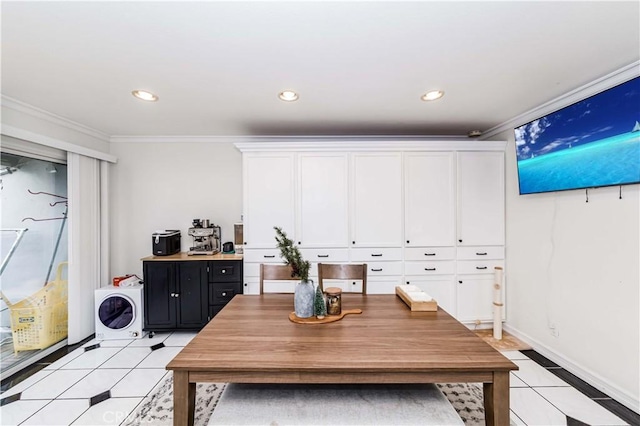 dining room featuring crown molding and light tile patterned floors