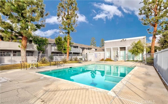 view of pool featuring a patio