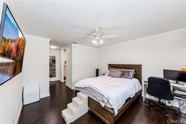 bedroom featuring dark hardwood / wood-style floors, ceiling fan, and ornamental molding