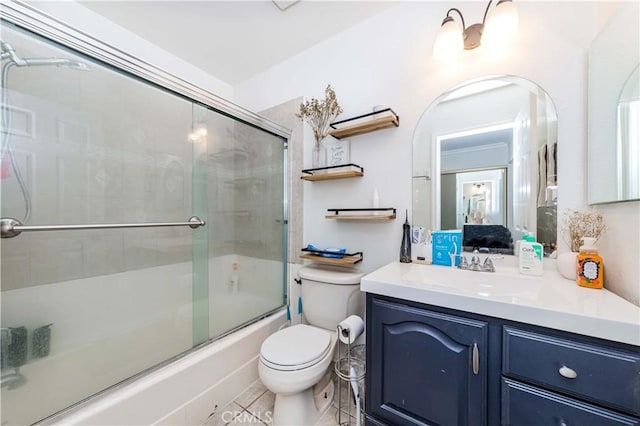 full bathroom featuring tile patterned floors, vanity, enclosed tub / shower combo, and toilet